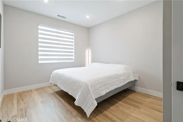 a bedroom with a bed and closet