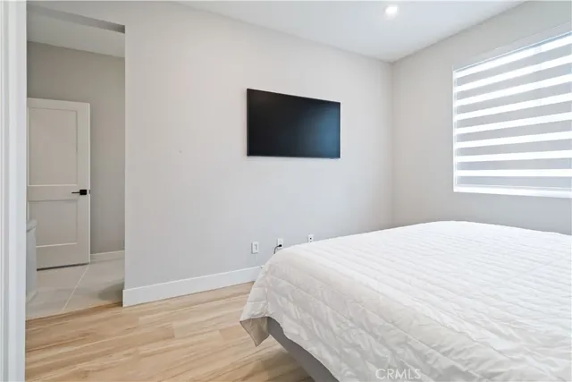 a bathroom with a sink a mirror and shower