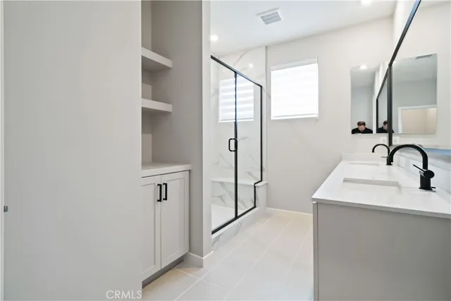 a bathroom with a sink a mirror and a window