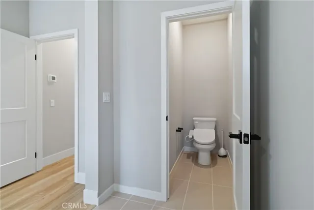 a view of a room with wooden floor and windows