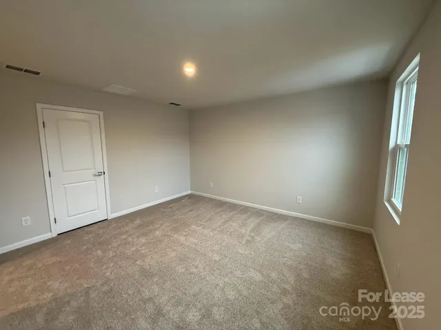 an empty room with a natural light