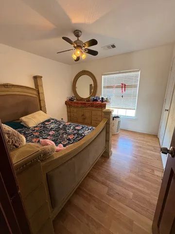 a view of a room with furniture and window