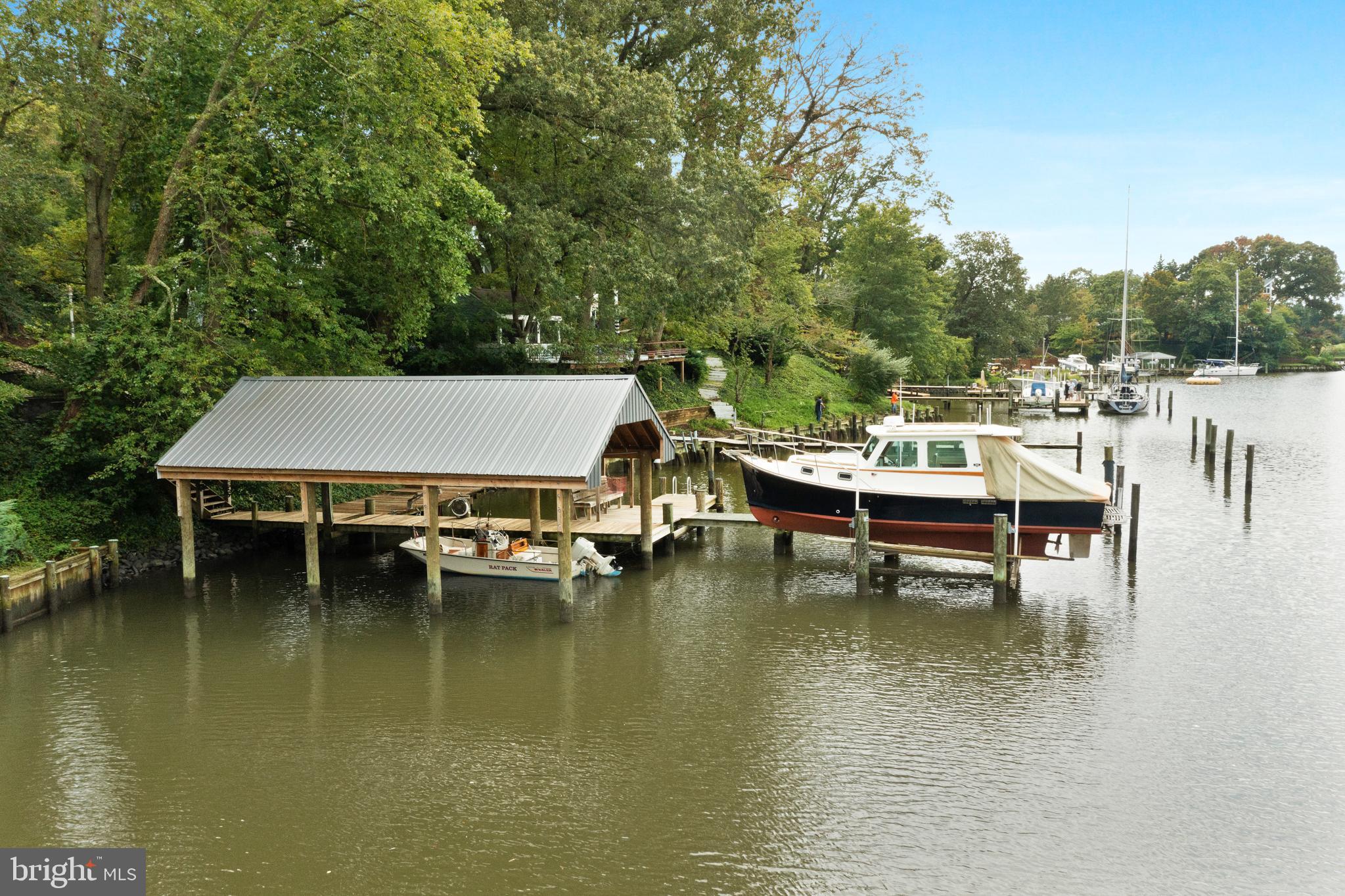 1858 Burley Road Annapolis, MD 21409 - Photo 16 of 76 a view of a lake with boats and trees in the background