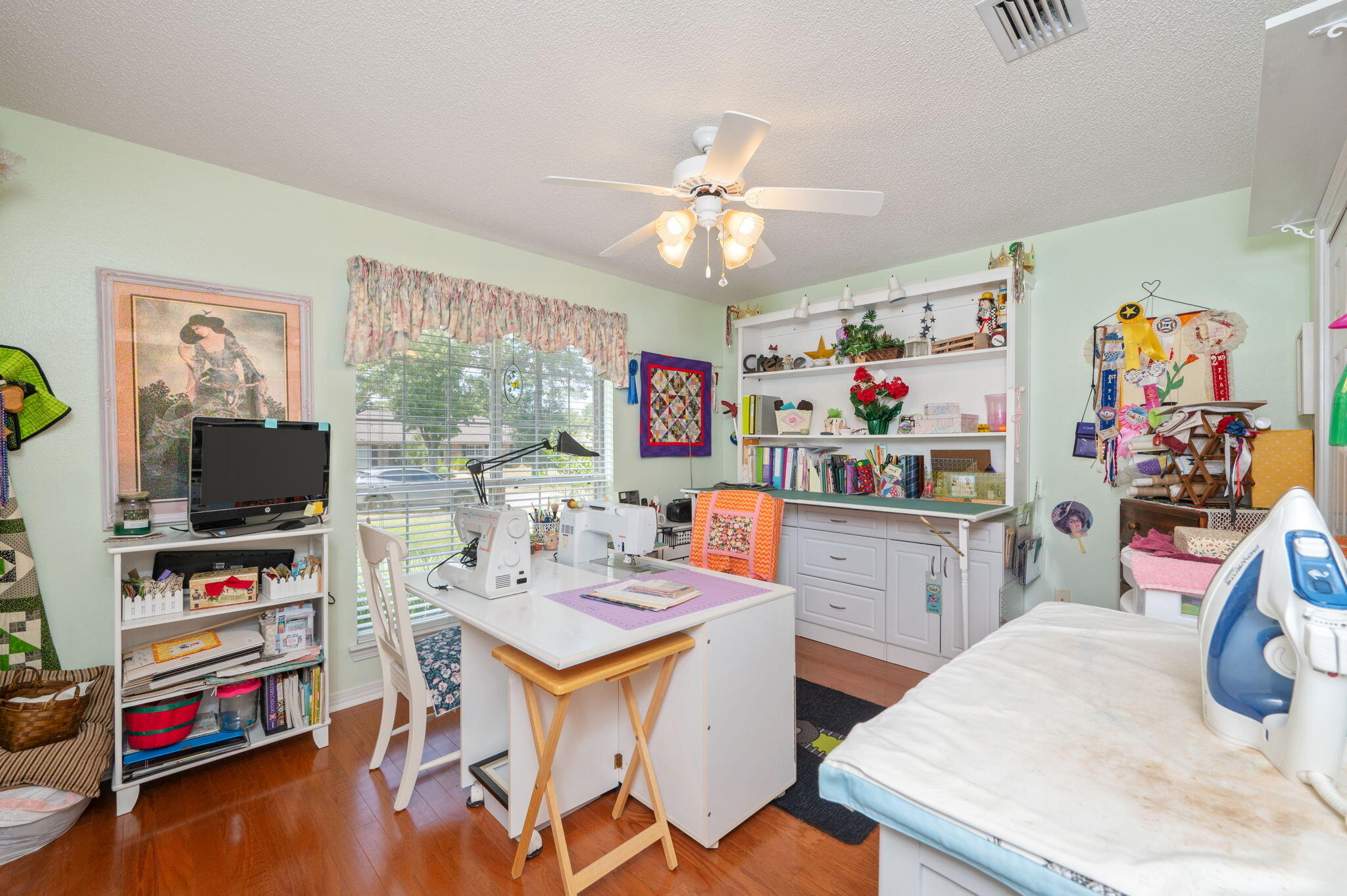 5863 Hunting Meadows Drive Crestview, FL 32536 - Photo 20 of 49 a room with furniture a flat screen tv and a window