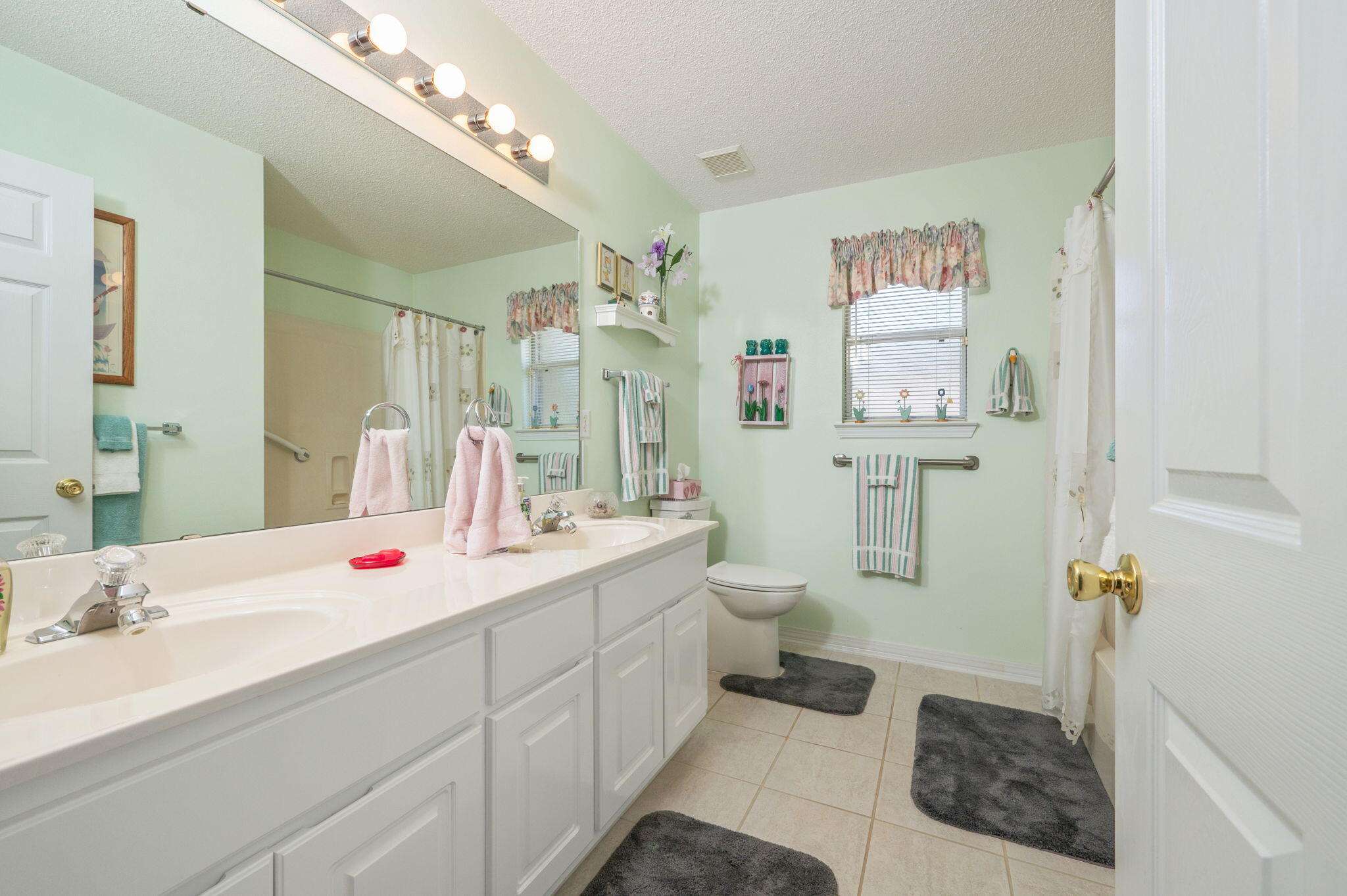 5863 Hunting Meadows Drive Crestview, FL 32536 - Photo 21 of 49 a spacious bathroom with a sink double vanity and toilet