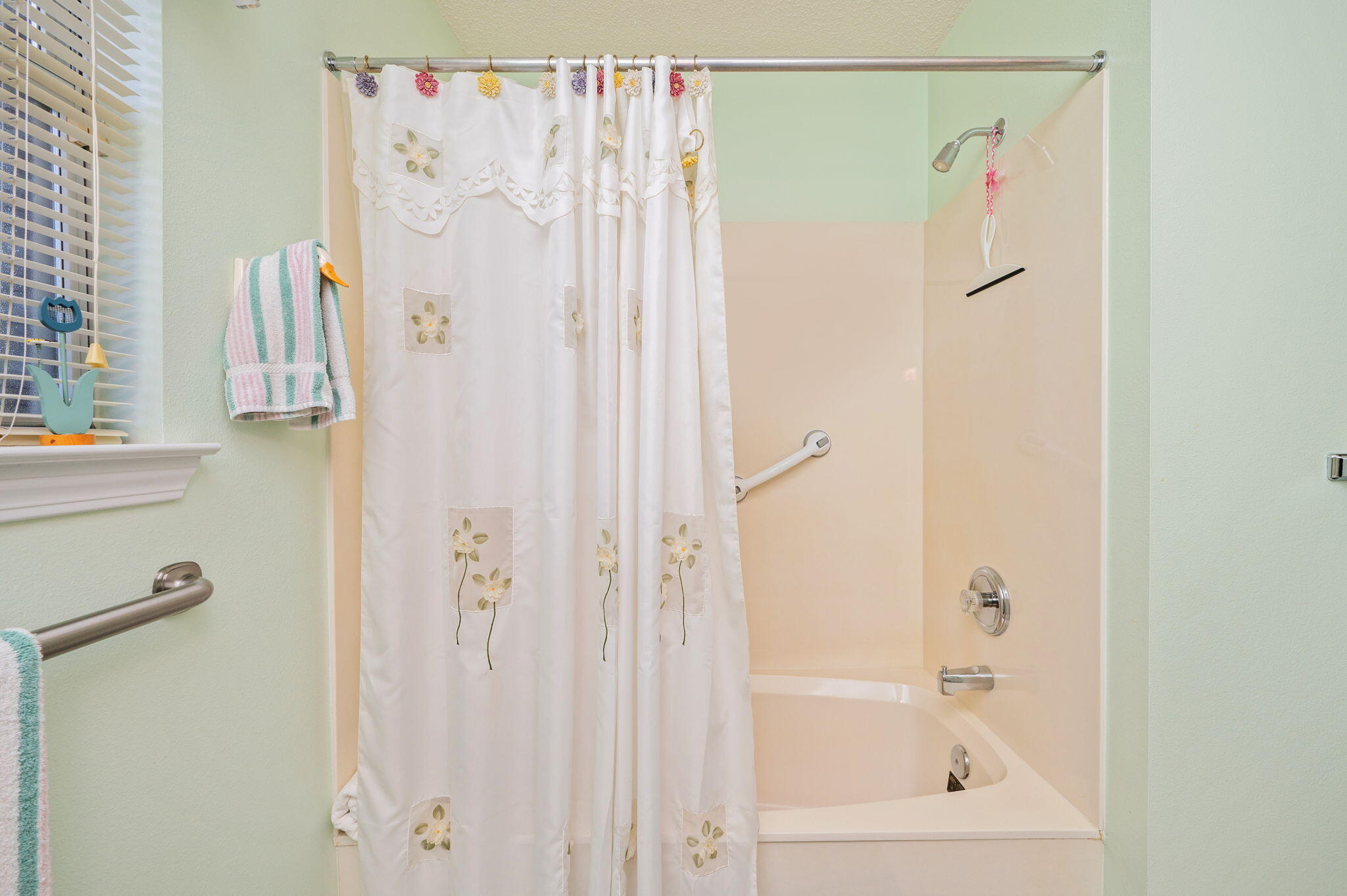 5863 Hunting Meadows Drive Crestview, FL 32536 - Photo 22 of 49 a bathroom with a shower curtain and a sink