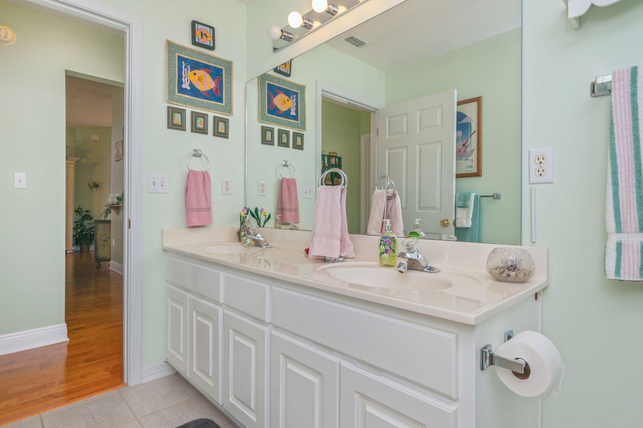 5863 Hunting Meadows Drive Crestview, FL 32536 - Photo 23 of 49 a bathroom with a sink and a mirror