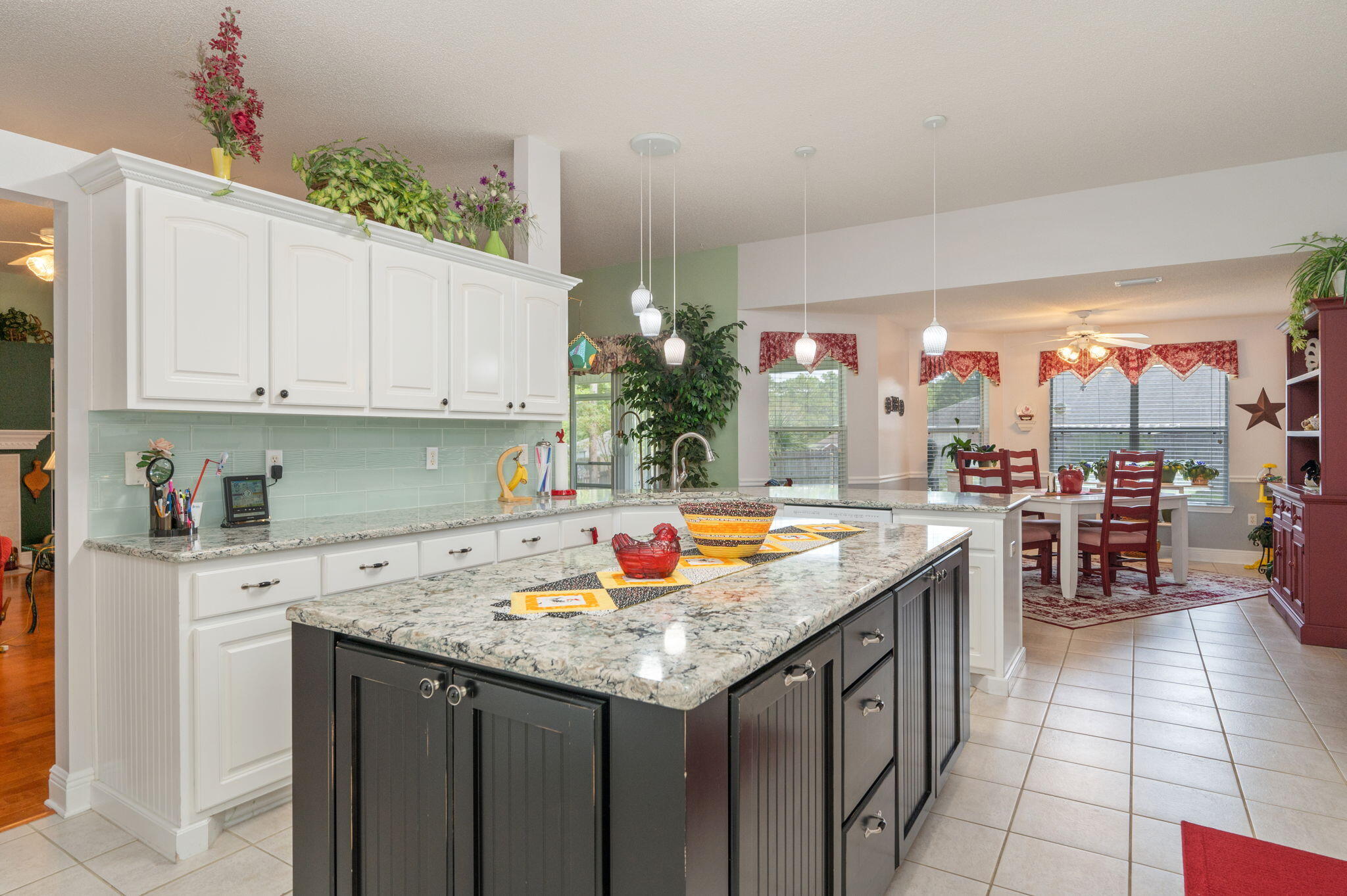 5863 Hunting Meadows Drive Crestview, FL 32536 - Photo 25 of 49 a kitchen with a stove and a sink