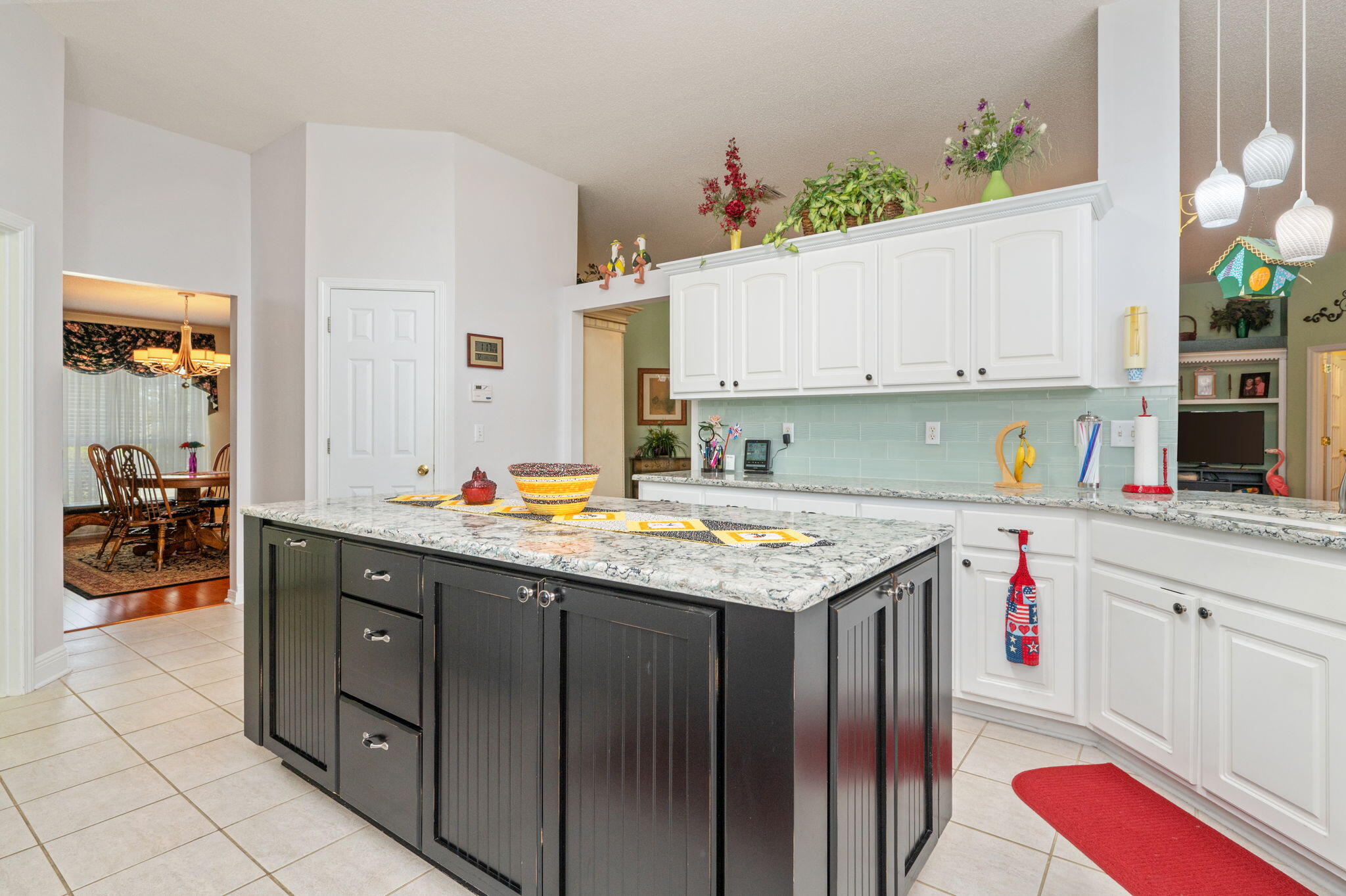 5863 Hunting Meadows Drive Crestview, FL 32536 - Photo 30 of 49 a kitchen with a sink stove and cabinets