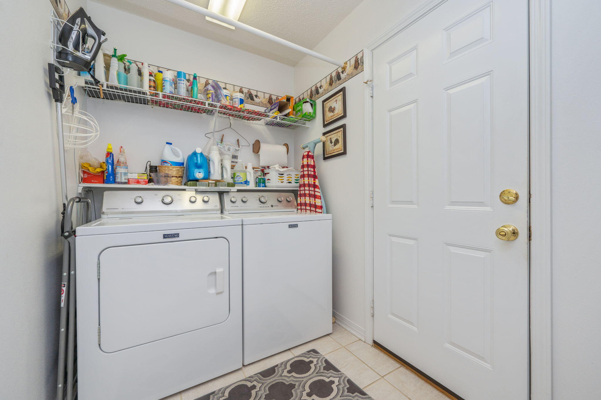 5863 Hunting Meadows Drive Crestview, FL 32536 - Photo 43 of 49 a view of storage and utility room with washer and dryer