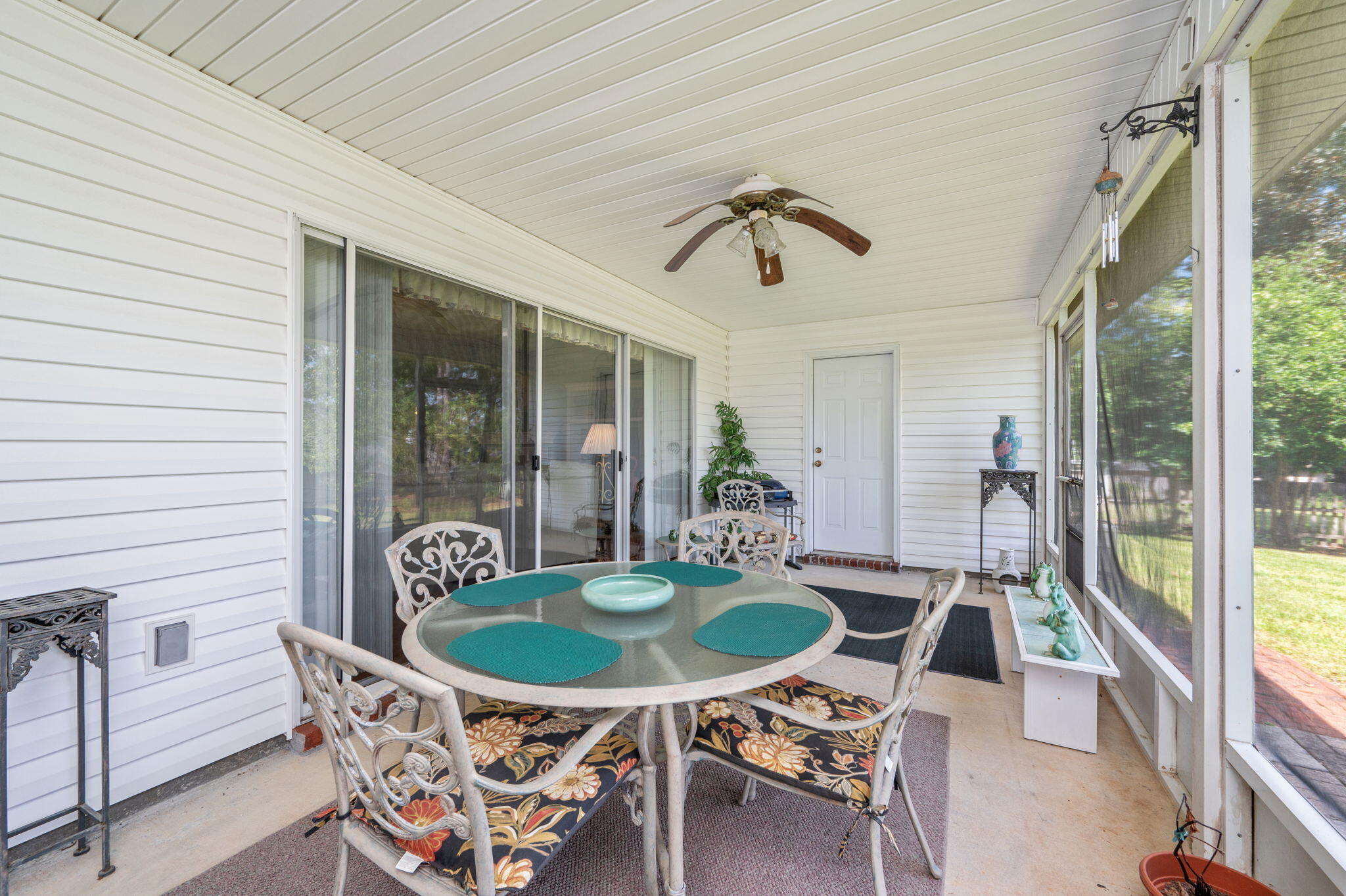 5863 Hunting Meadows Drive Crestview, FL 32536 - Photo 45 of 49 a table and chairs in a balcony