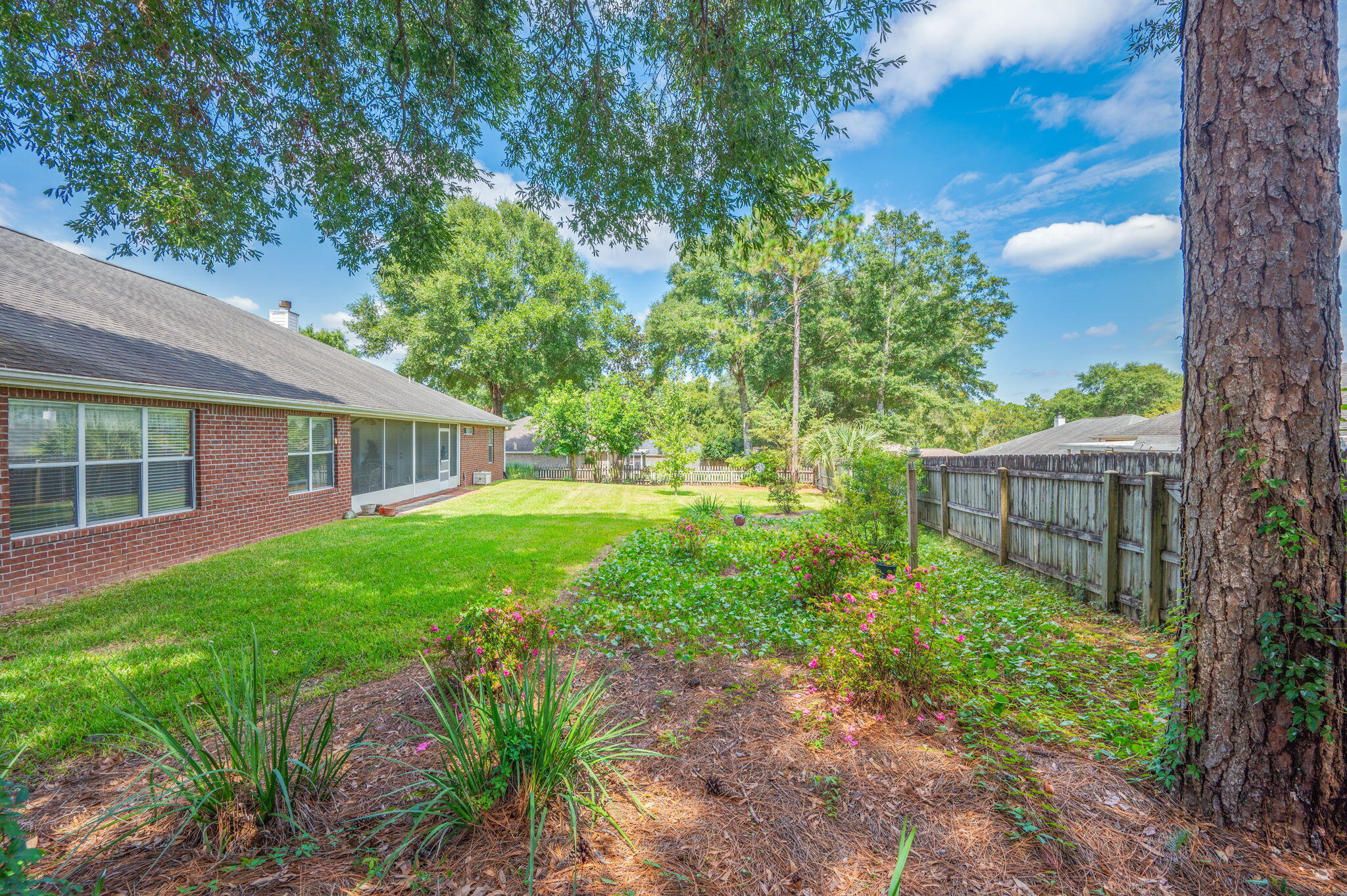 5863 Hunting Meadows Drive Crestview, FL 32536 - Photo 47 of 49 a view of backyard with garden and deck