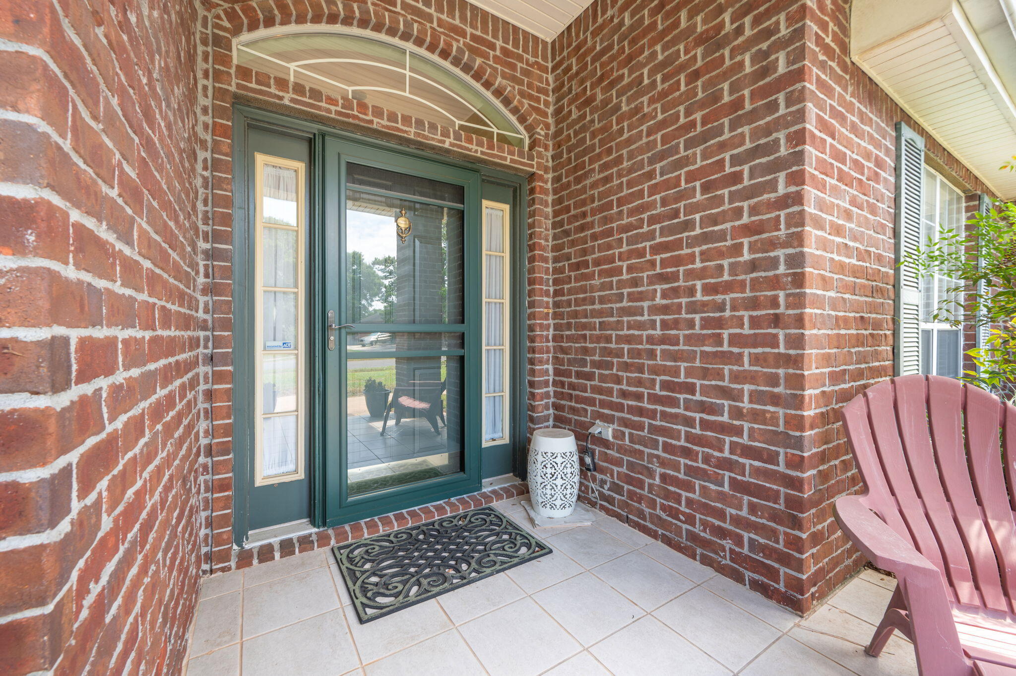 5863 Hunting Meadows Drive Crestview, FL 32536 - Photo 5 of 49 a view of a brick house with many windows