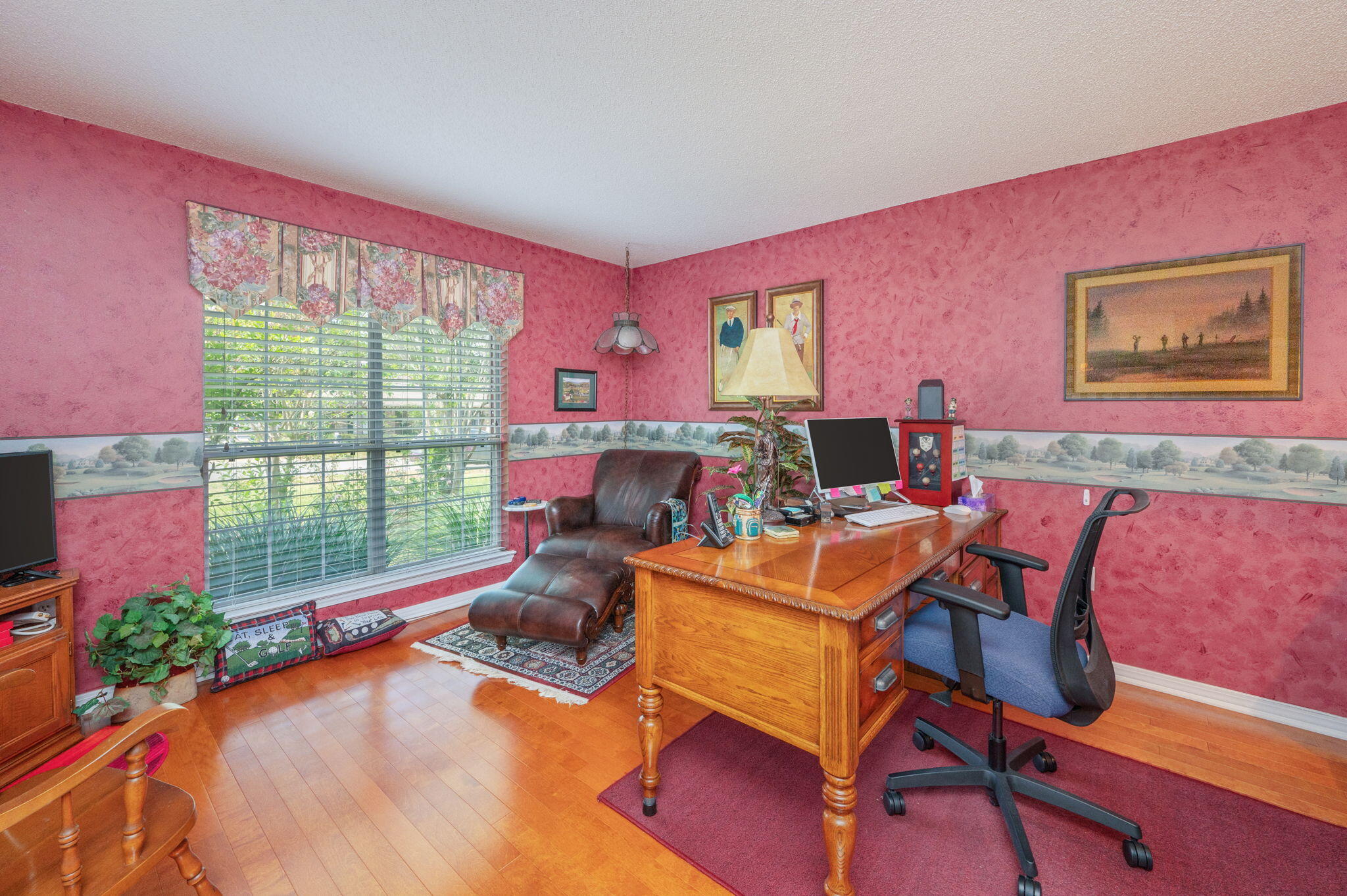 5863 Hunting Meadows Drive Crestview, FL 32536 - Photo 9 of 49 a living room with furniture a flat screen tv and a floor to ceiling window