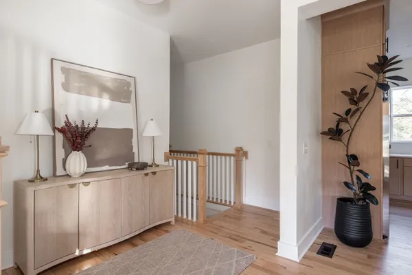a white bath tub sitting in a bathroom next to a window