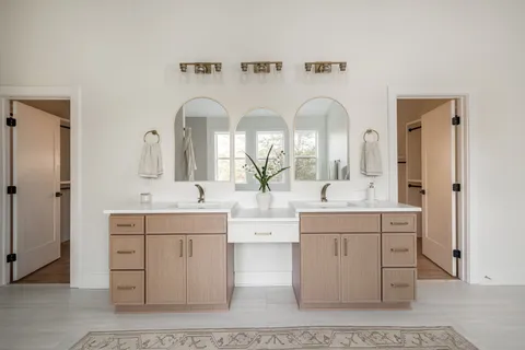 a living room with furniture a couch and a window