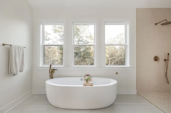 a living room with furniture a couch and a window