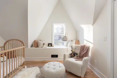 a view of a patio with table and chairs potted plants with floor to ceiling window