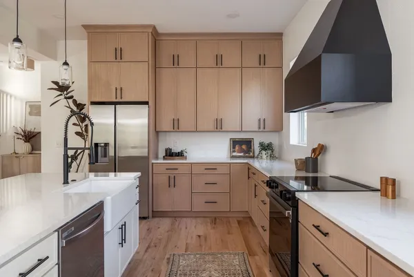 a kitchen with granite countertop cabinets and white appliances