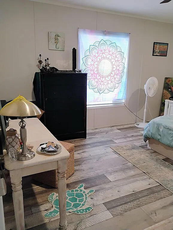 650 Satellite Road Graceville, FL 32440 - Photo 18 of 23 a living room with furniture and a window