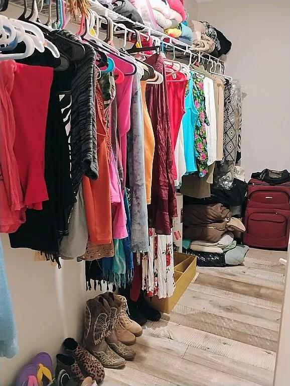 650 Satellite Road Graceville, FL 32440 - Photo 21 of 23 a view of walk in closet with clothes and shoes