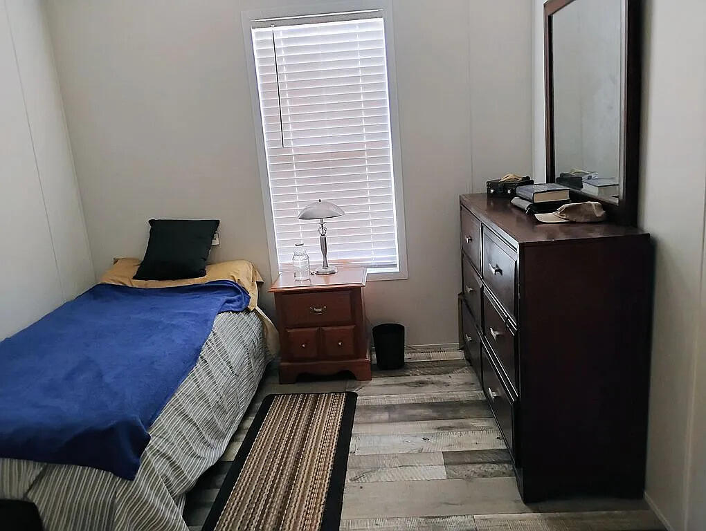 650 Satellite Road Graceville, FL 32440 - Photo 22 of 23 a bedroom with a bed and a window