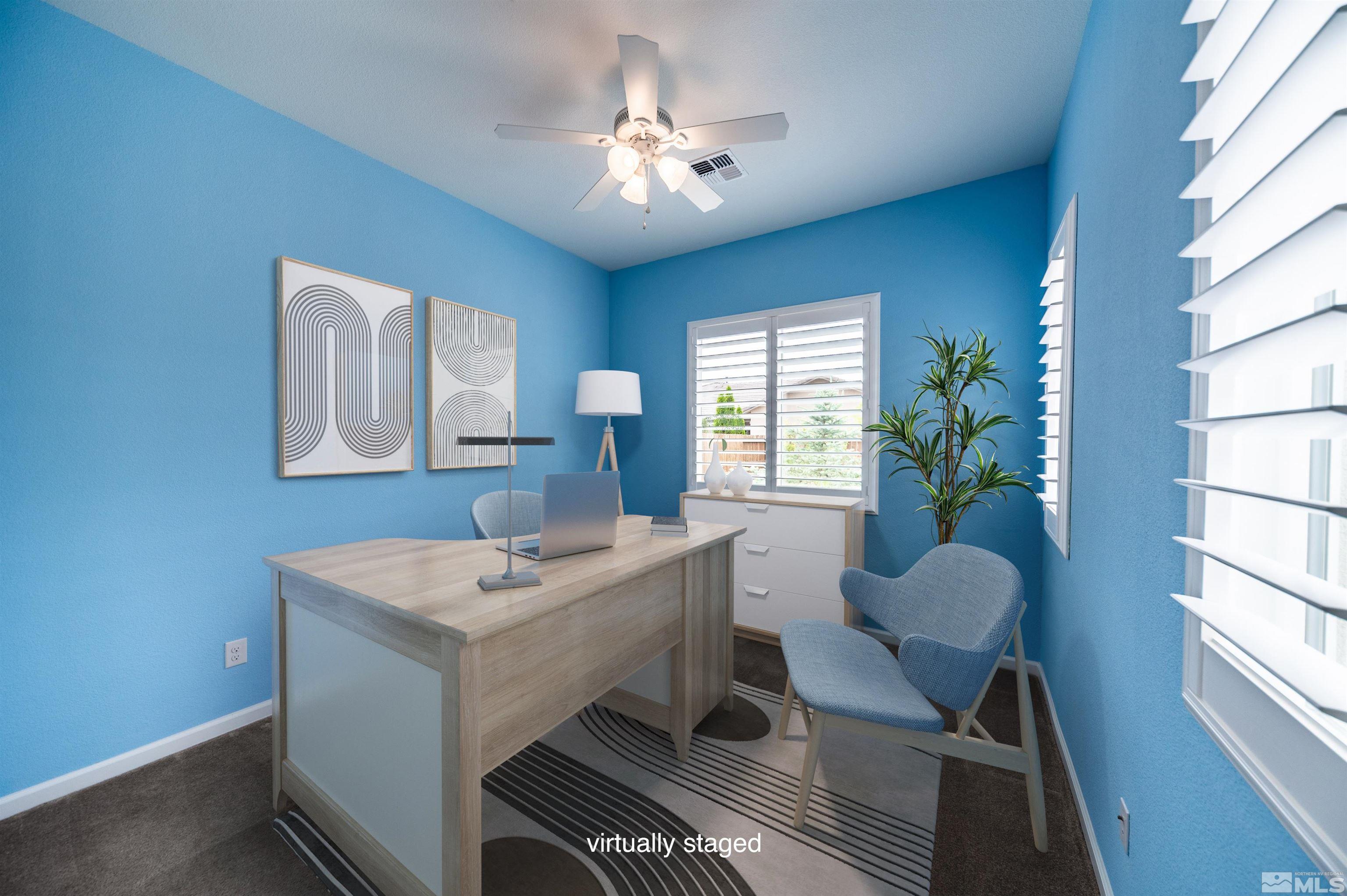 2305 Trakehner Lane Reno, NV 89521 - Photo 29 of 40 a view of a a dining room with furniture window and wooden floor