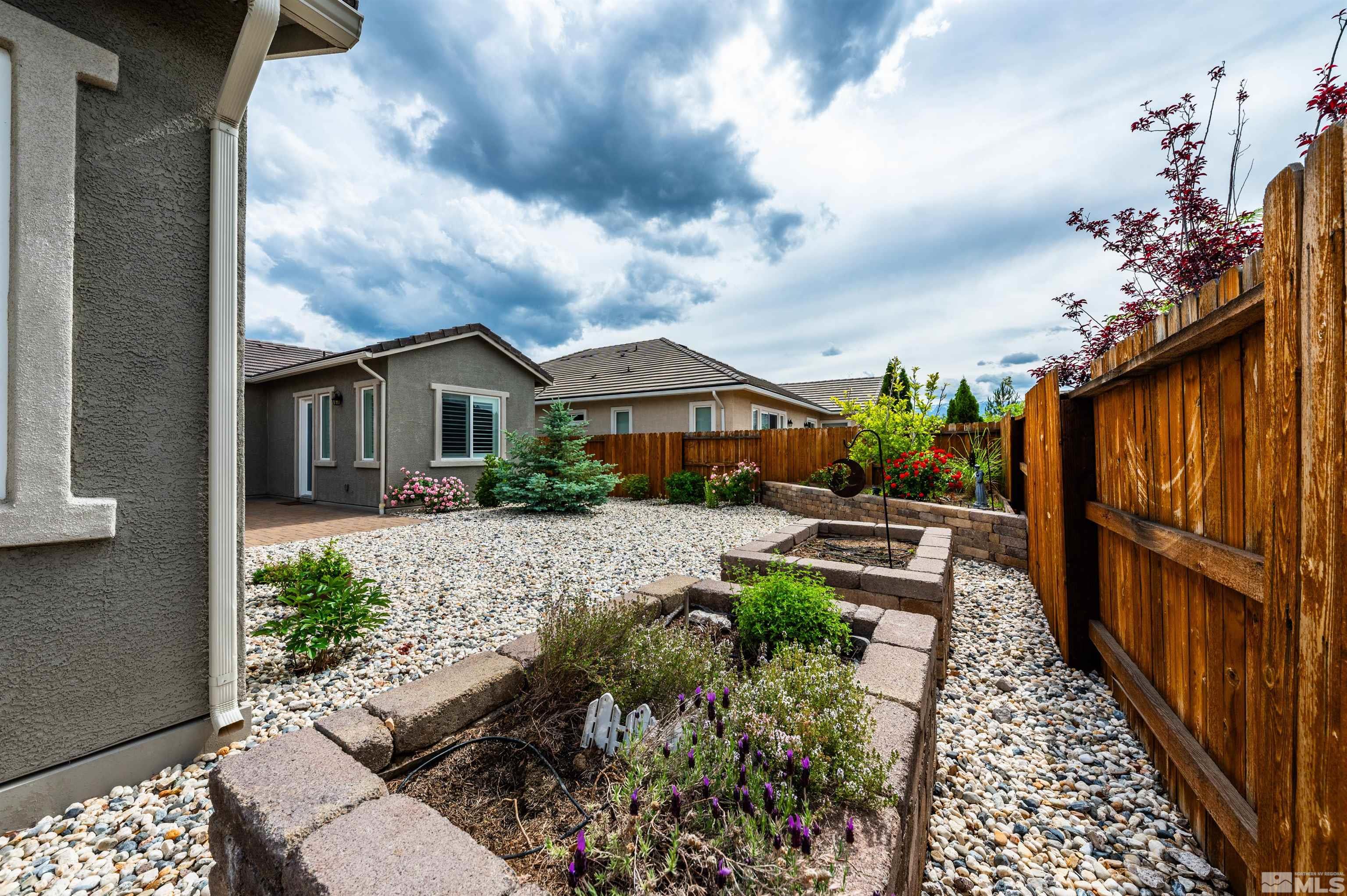 2305 Trakehner Lane Reno, NV 89521 - Photo 32 of 40 a front view of house with a garden