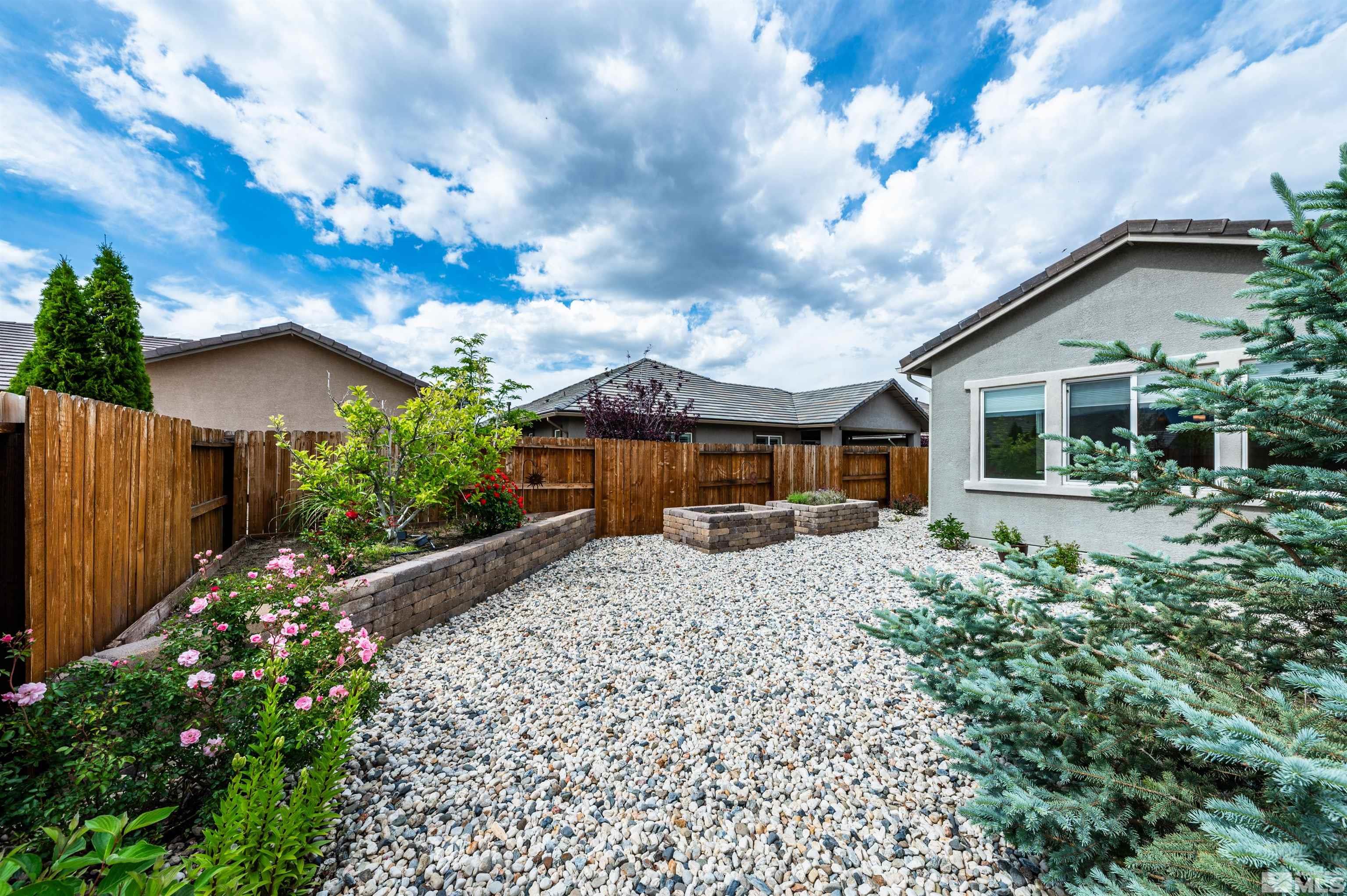2305 Trakehner Lane Reno, NV 89521 - Photo 33 of 40 a front view of a house with garden