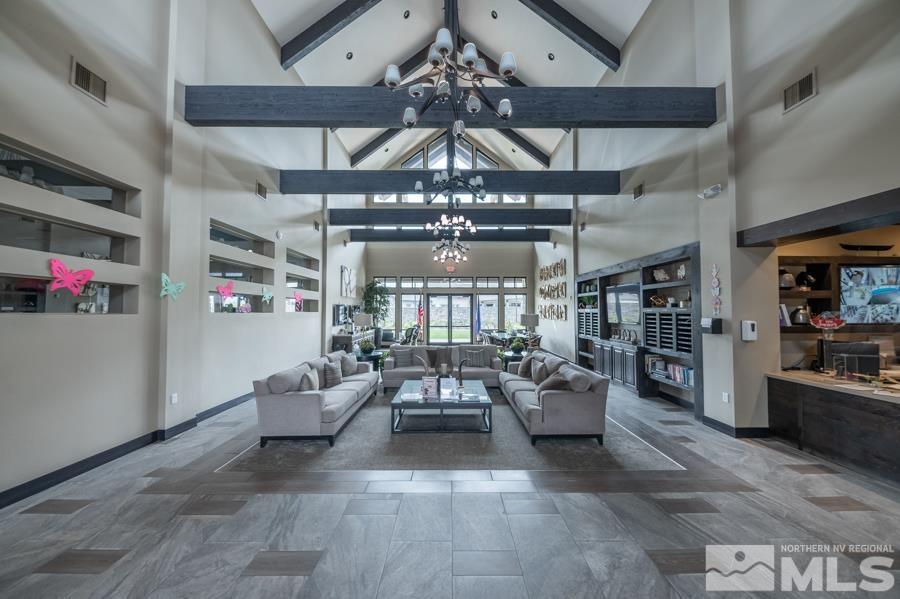 2305 Trakehner Lane Reno, NV 89521 - Photo 35 of 40 a living room with patio furniture and a chandelier