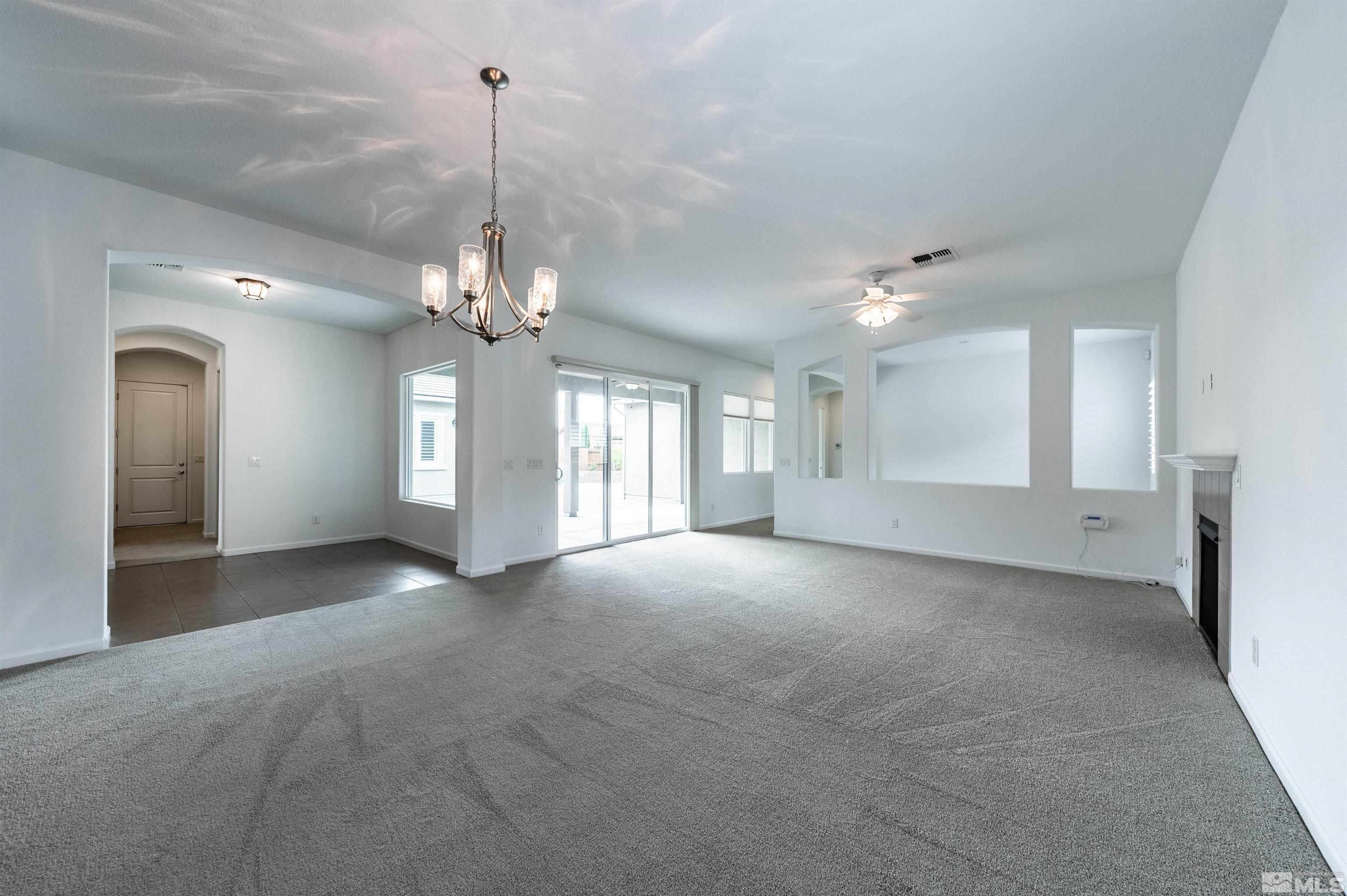 2305 Trakehner Lane Reno, NV 89521 - Photo 7 of 40 a view of a big room with windows and chandelier