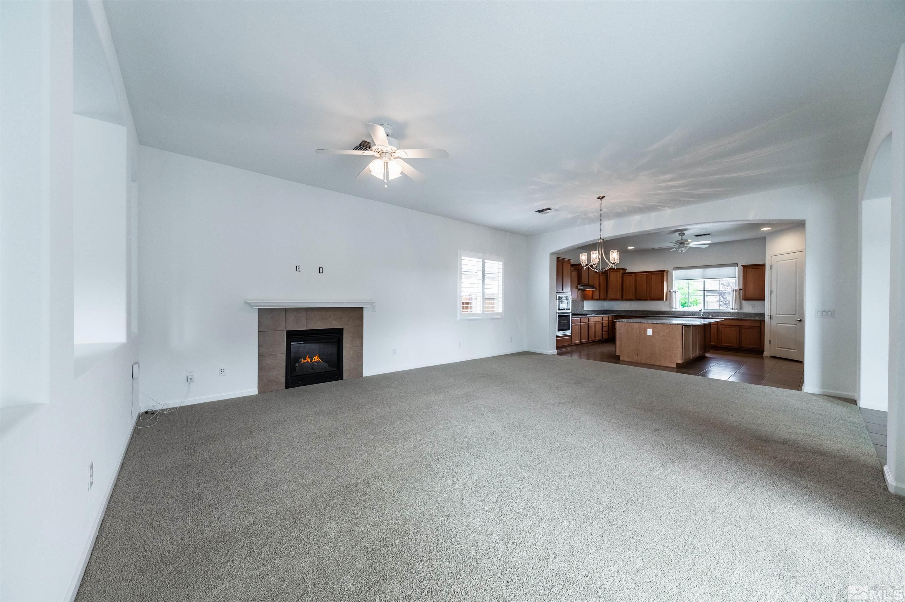 2305 Trakehner Lane Reno, NV 89521 - Photo 9 of 40 a view of an empty room with a fireplace