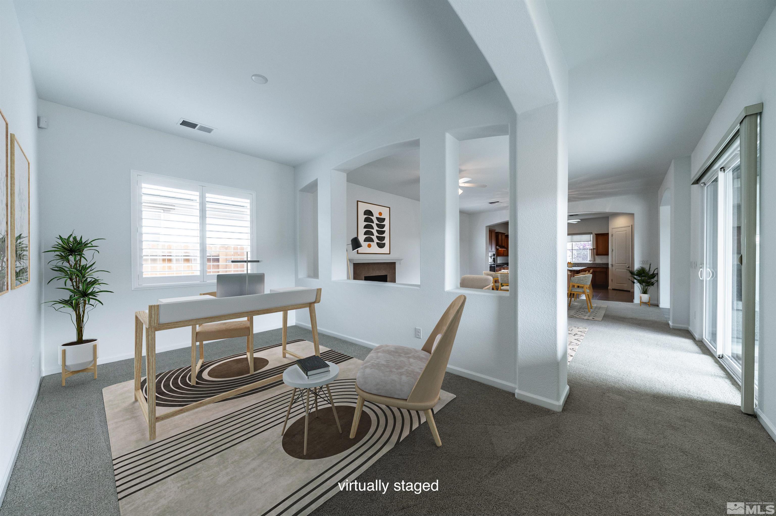 2305 Trakehner Lane Reno, NV 89521 - Photo 10 of 40 a living room with furniture a wooden floor and a potted plant