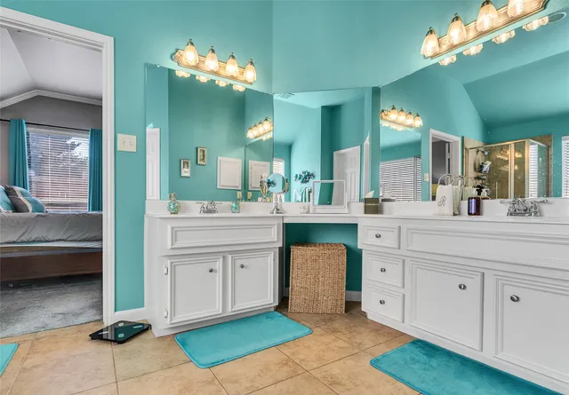 an aerial view of residential houses with outdoor space and swimming pool