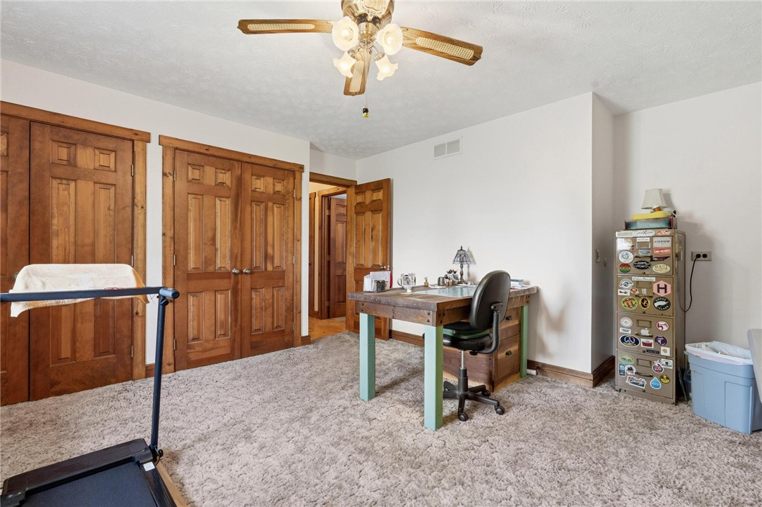 4971 Lackey Road Cedarville, OH 45314 - Photo 35 of 79 This spacious room features ample natural light, soft carpeting, and warm wooden accents throughout.