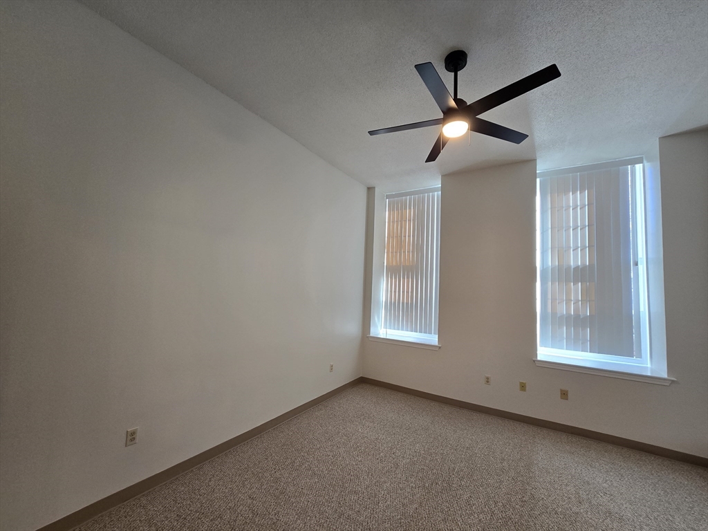 147 Rawson Road, Unit G3 Quincy, MA 02170 - Photo 14 of 20 a view of an empty room with a window