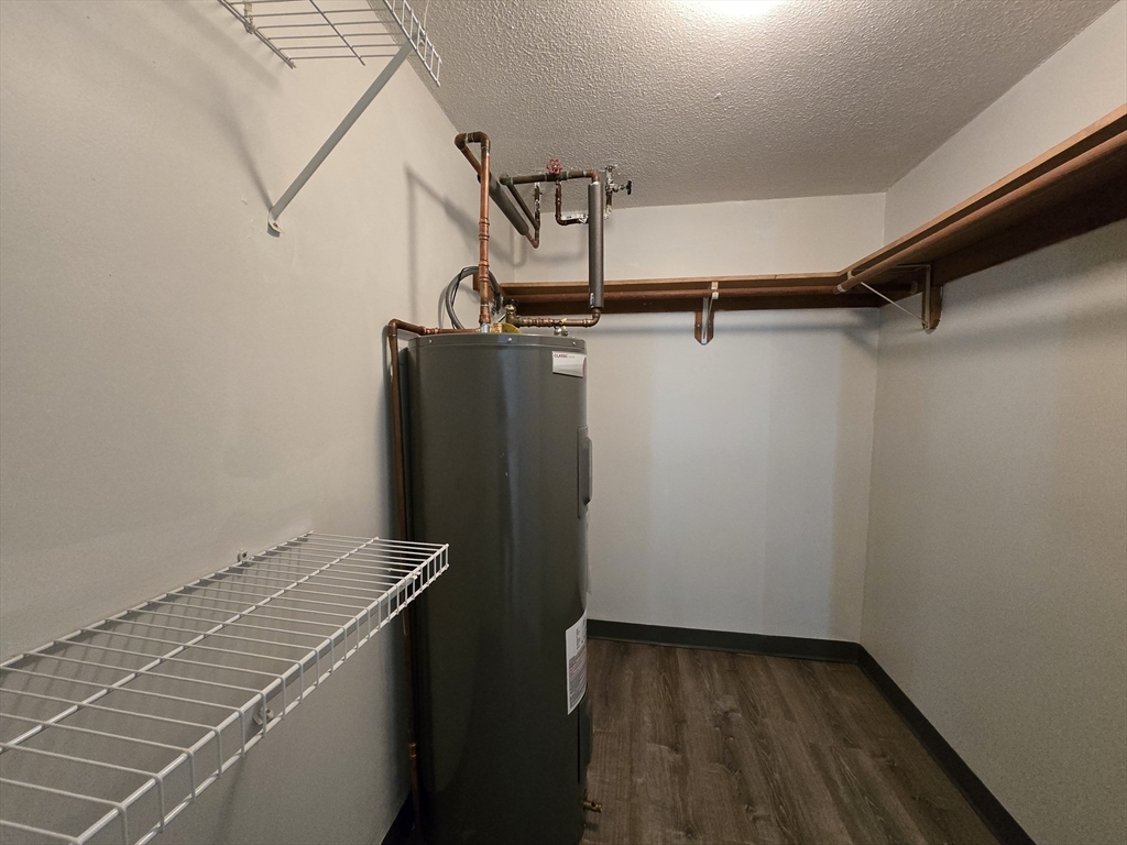 147 Rawson Road, Unit G3 Quincy, MA 02170 - Photo 16 of 20 a view of a room with racks on the wall