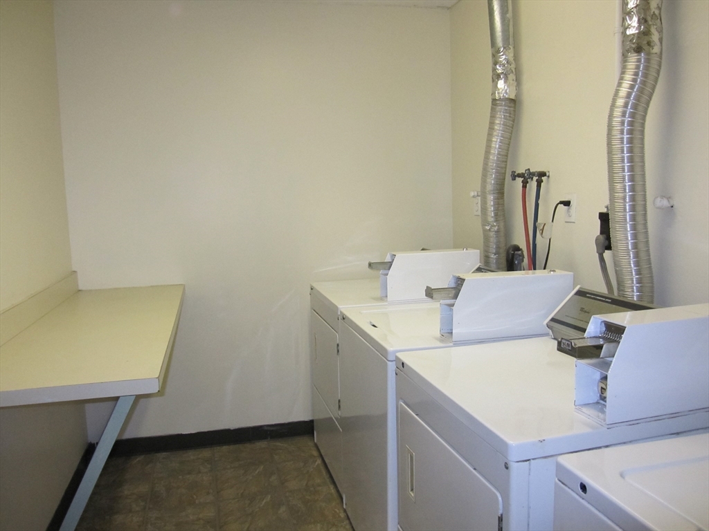 147 Rawson Road, Unit G3 Quincy, MA 02170 - Photo 17 of 20 a bathroom with a sink and a mirror