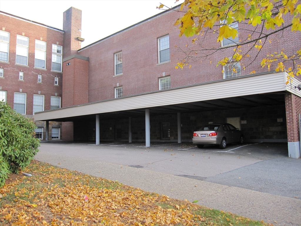 147 Rawson Road, Unit G3 Quincy, MA 02170 - Photo 19 of 20 a car parked in front of building
