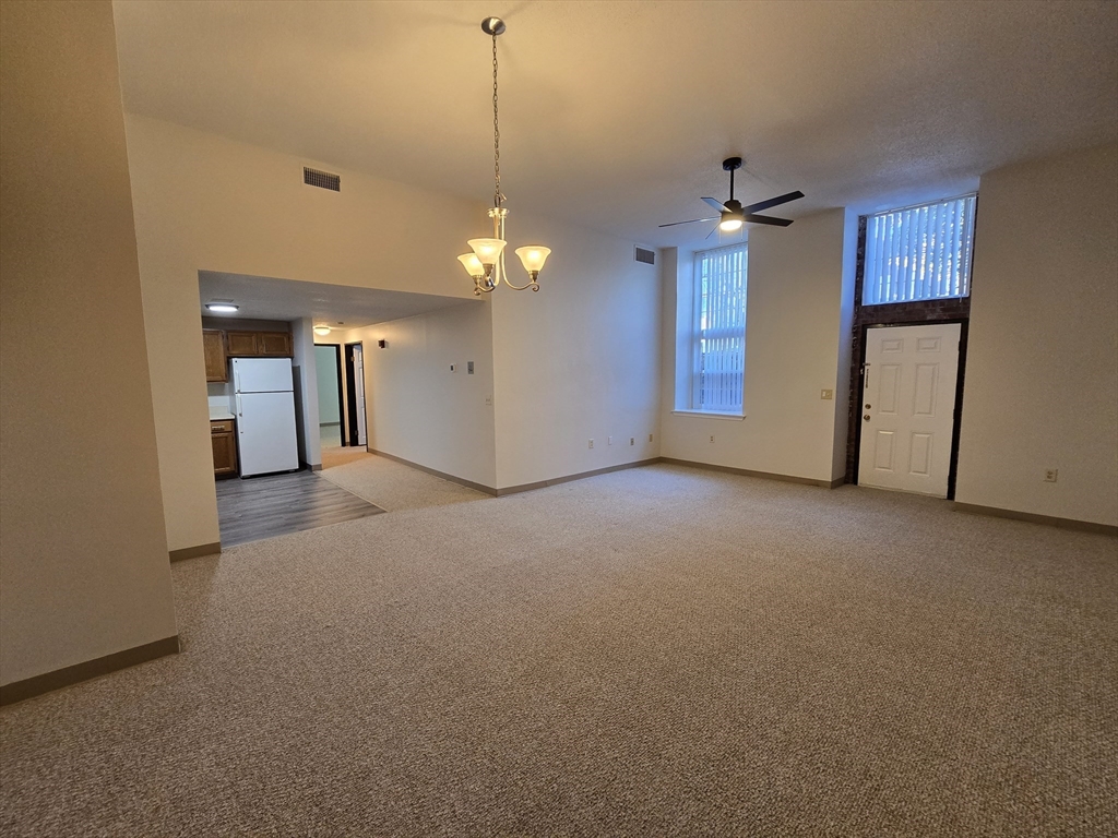 147 Rawson Road, Unit G3 Quincy, MA 02170 - Photo 3 of 20 a view of a livingroom with a chandelier