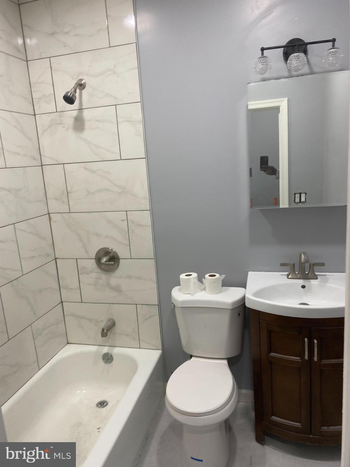1820 Hope Street Baltimore, MD 21202 - Photo 11 of 14 a bathroom with a sink a toilet and bathtub