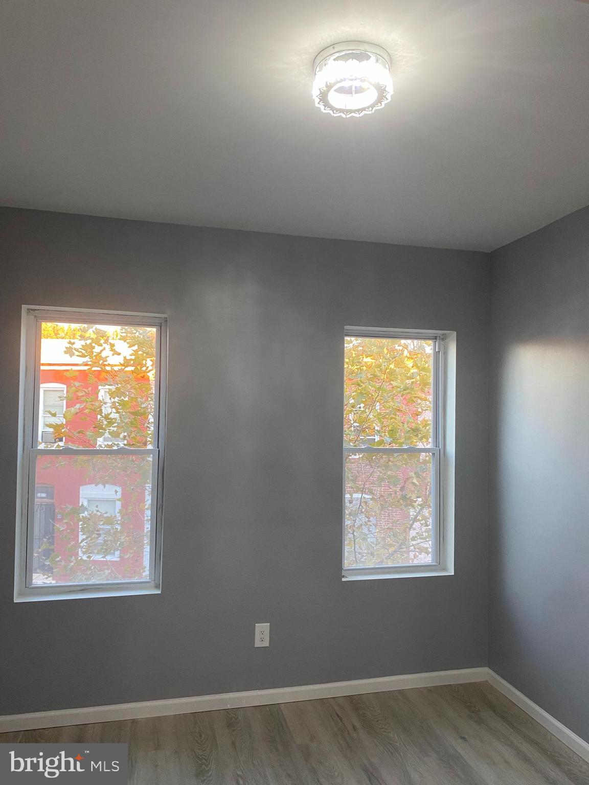 1820 Hope Street Baltimore, MD 21202 - Photo 6 of 14 a view of an empty room with a window