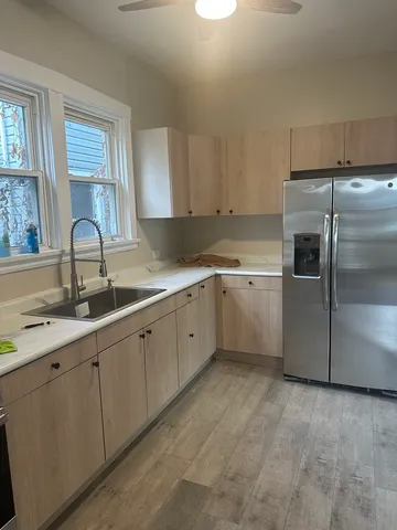 a kitchen with a sink stainless steel appliances and cabinets
