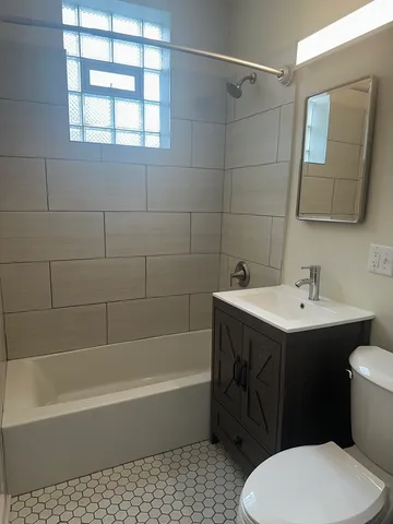 a bathroom with a sink toilet and bathtub