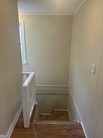 a view of entryway with wooden floor