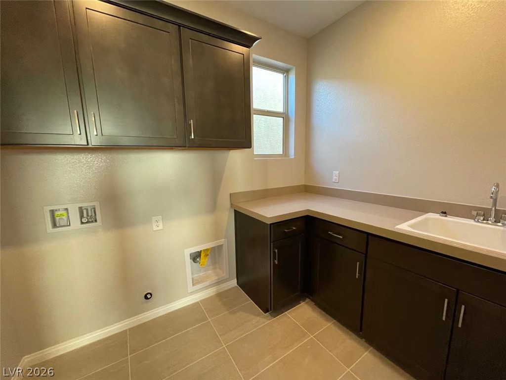 11 Rancho Maria Street Las Vegas, NV 89148 - Photo 13 of 27 Ample cabinetry and tile flooring define this highly functional workspace.