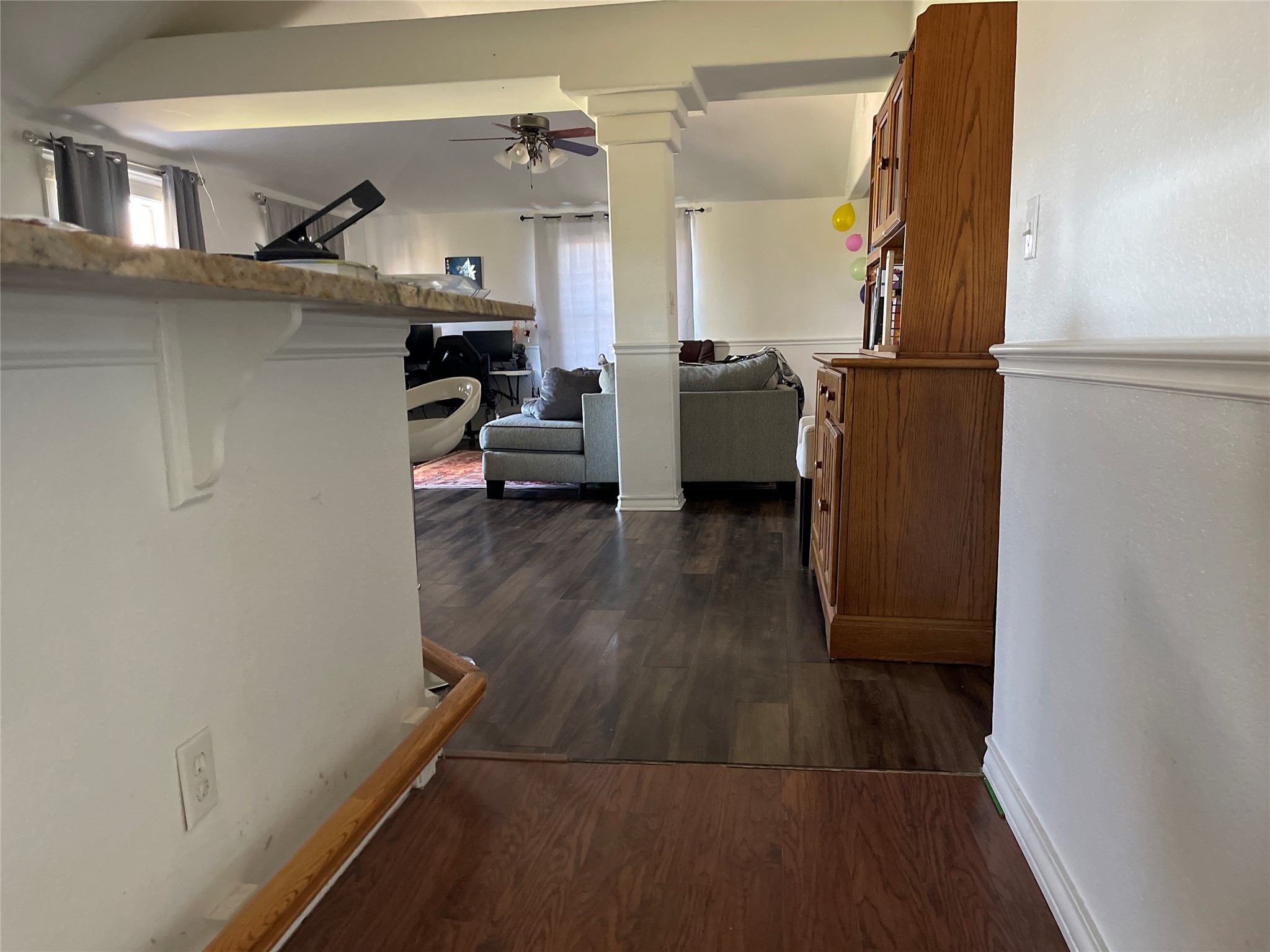 12212 Ballerstedt Road Elgin, TX 78621 - Photo 12 of 29 Gleaming wood floors flow seamlessly through this inviting and open single-level layout.