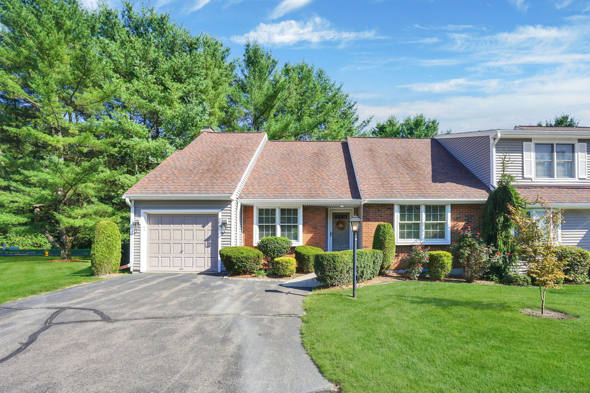 369 The Meadows, Unit 369 Enfield, CT 06082 - Photo 1 of 1 front view of a house with a yard