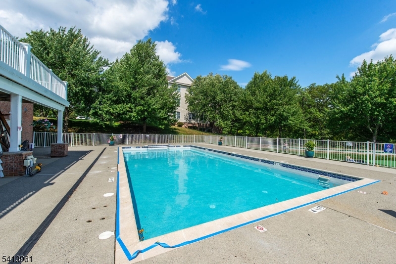 29 Ridgeview Lane, Unit 29 Mount Arlington, NJ 07856 - Photo 15 of 17 a view of a swimming pool with a patio