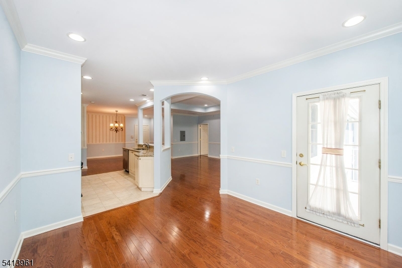 29 Ridgeview Lane, Unit 29 Mount Arlington, NJ 07856 - Photo 5 of 17 wooden floor in an empty room with a window
